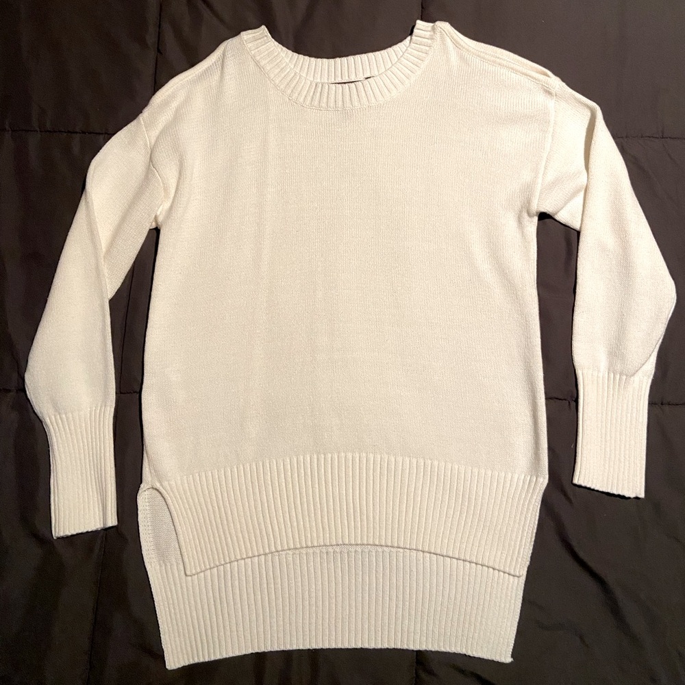 BCBG white cold shoulder sweater with high and low back. Thick and warm.